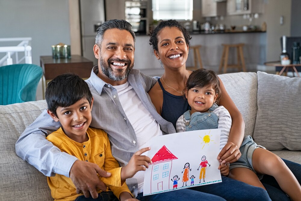 Photo of a family sitting on the couch.